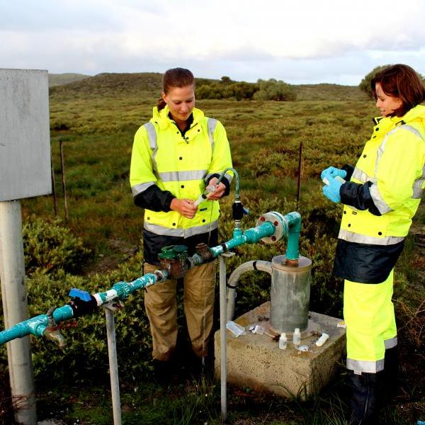 A picture of people saving water.