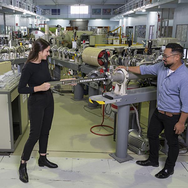 Francesca Wilkins and Dr Armand Atanacio with STAR accelerator one of the instruments used in Total Flourine Analaysis