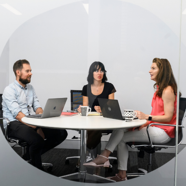 Three members sit at the nandin Deep Technology Hub at ANSTO's Lucas Heights campus.