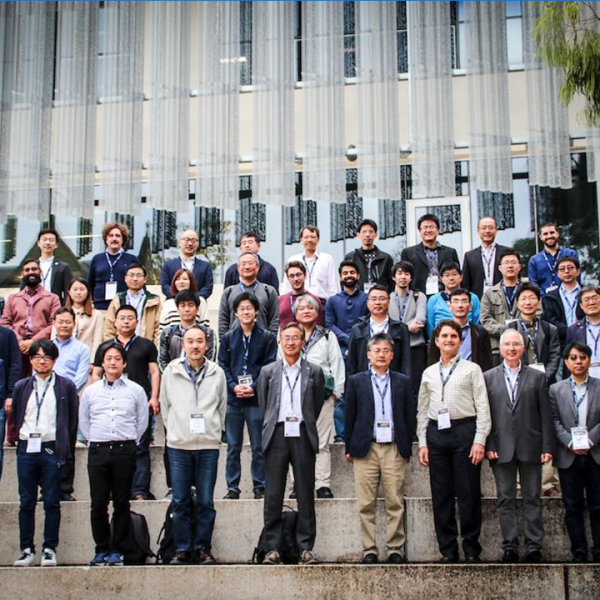 Many people who have attended a workshop, standing of steps