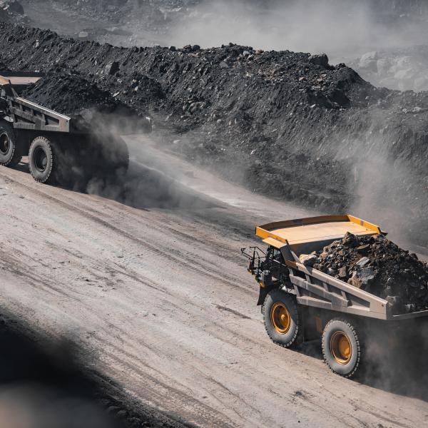 mining trucks creating dust