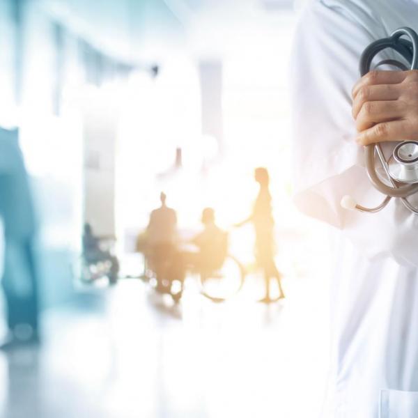 Medicine doctor with stethoscope in hand and Patients come to the hospital