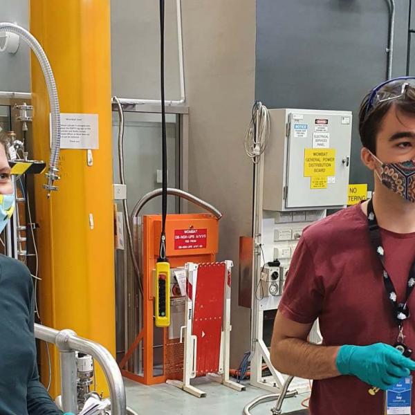 Monica and Hamish preparing pyrite powder mineral samples for neutron diffraction measurements using the Wombat instrument at ACNS