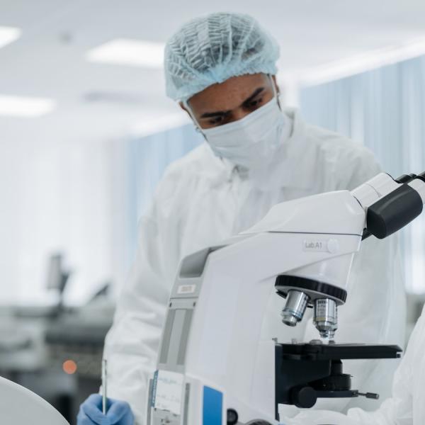 science researchers with microscope