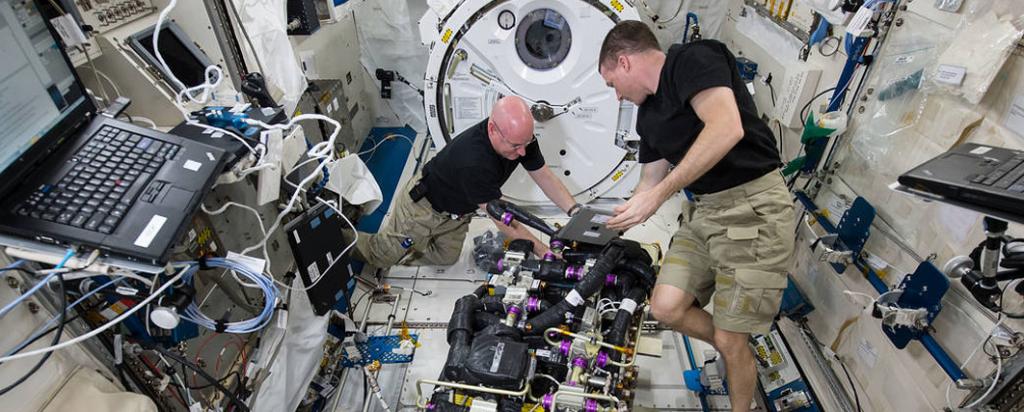 Astronauts carrying out experiments on the ISS