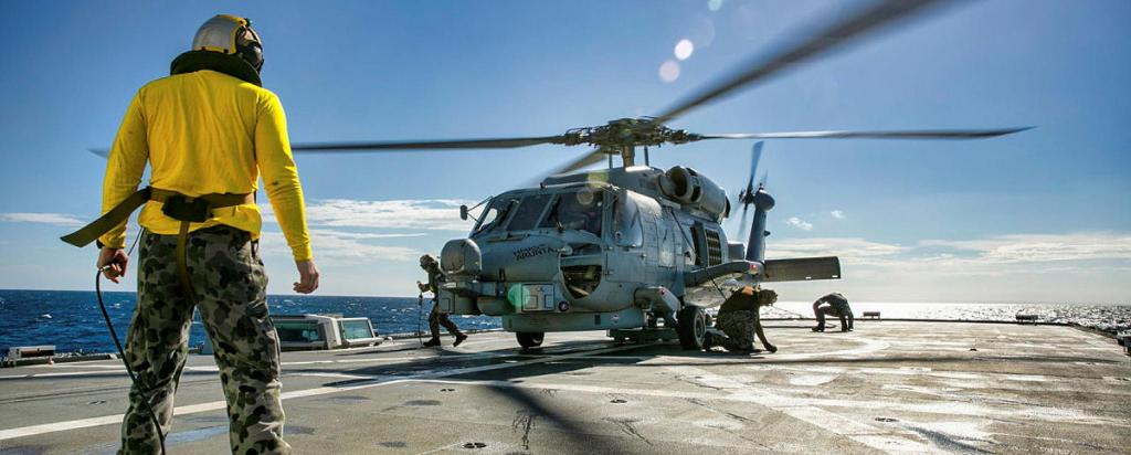 Helicopter landing on naval vessel