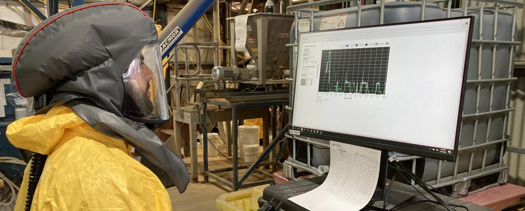 ANSTO Staff member reviewing data on computer screen in Minerals pilot facility