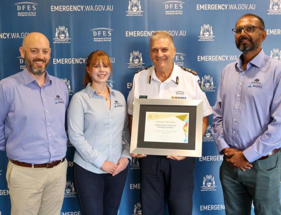 Radioactive Capsule Certificate. ANSTO’s Andrew Popp, Rhiarn Hoban, and Prashant Maharaj pictured with DFES Deputy Commissioner Operations, Craig Waters AFSM.