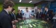 An image of tour guides showing students around ANSTO.