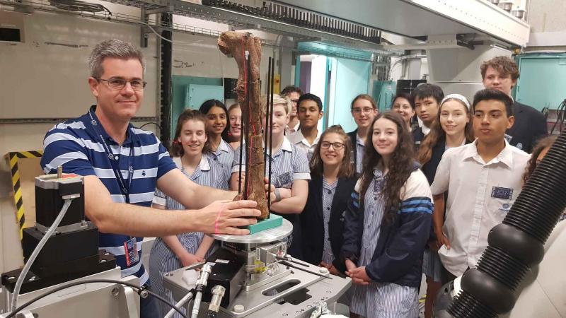 Jospeh Bevitt with dinosaur bone at Synchrotron