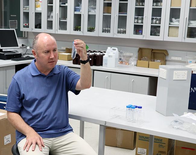 Craig Woodward with bushfire samples