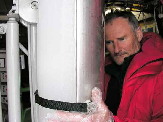 Dr Andrew Smith with a core that has been extracted from the ice