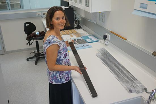 Dr Krystyna Saunders with sediment core