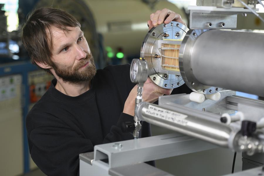 Dr Klaus Wilcken loading samples on an accelerator