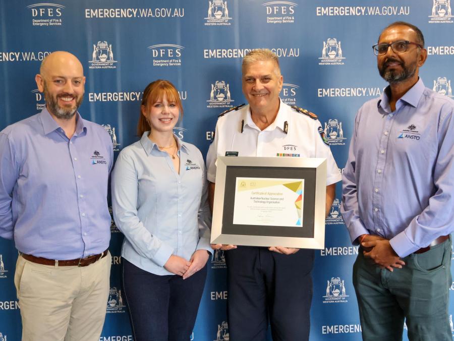 Radioactive Capsule Certificate. ANSTO's Andrew Popp, Rhiarn Hoban, and Prashant Maharaj pictured with DFES Deputy Commissioner Operations, Craig Waters AFSM.