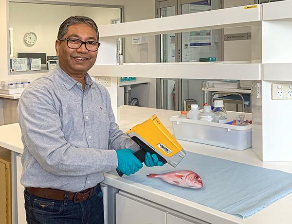 Dr Debashish Mazumder holds scanner