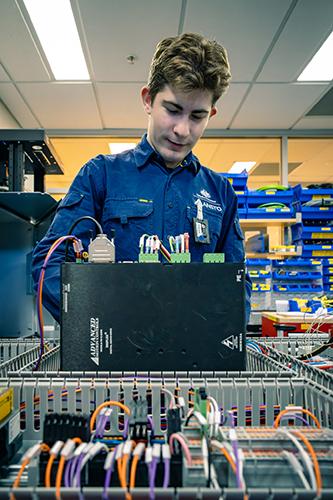 Apprentice working on electronics