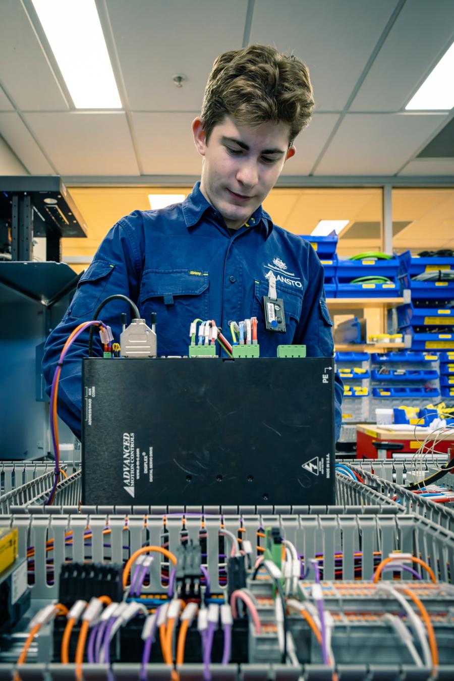 Apprentice working on electronics