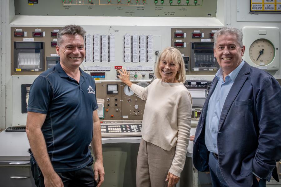 (left to right) Rod Dowler, Robyn Fennell and Shaun Jenkinson in front of the historic reactor control room panels
