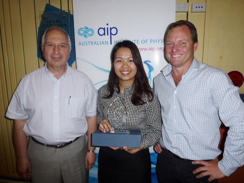 Linh Tran receiving award