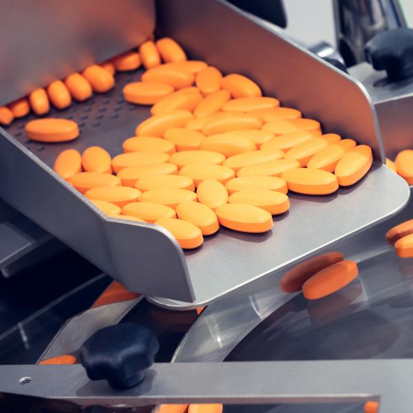 Pharmaceutical production line, production of tablets or vitamins manufacturing, tablet conveyor