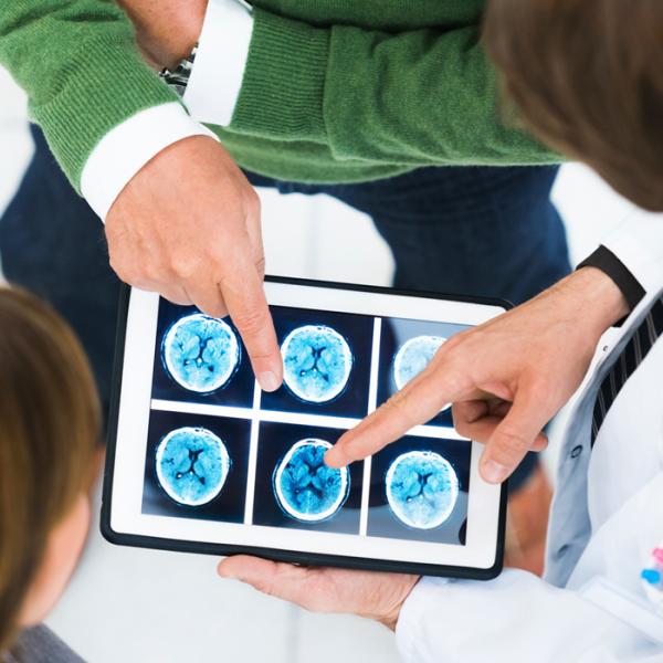 doctors examine scan